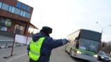 Russia -- Traffic patrol officer stops a bus on Don Motorway, 02Apr2010