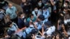 Pro-democracy lawmaker Wu Chi-wai scuffles with police during a march against new security laws, near China's Liaison Office, in Hong Kong, China May 22, 2020. REUTERS/Tyrone Siu