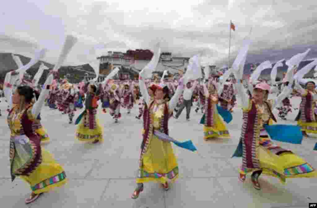 China -- Tibetan performers shout " Cheerio! China!" "Cheerio! Olympic" during a rehearsal to welcome the Olympic flame in front of the Potala palace in Lhasa on June 20, 2008